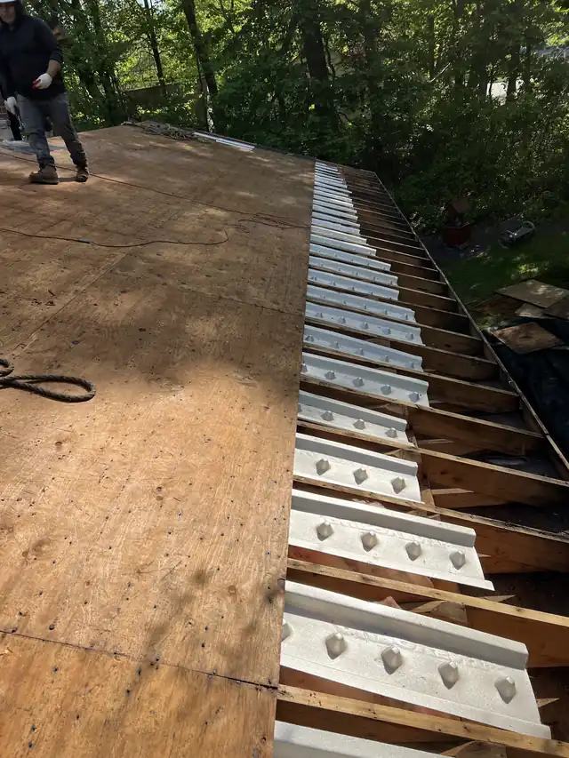 Roof Snow Removal job in progress for Tim's Roofing and Siding